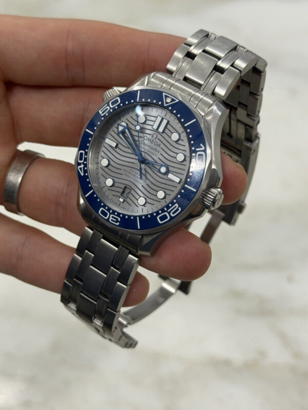 57_1fc9dc04-87d9-40a0-9a98-7bbb31192bab 2024 Omega Seamaster Steel Gray Dial 42mm Automatic Watch 210.30.42.20.06.001
