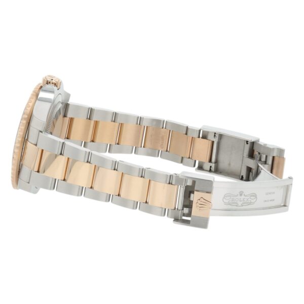 57_8bd4c7fc-4d23-4220-9e84-92a688a93da5 2024 Rolex GMT Black Dial Gold & Steel 40mm Automatic Men’s Watch 126711CHNR