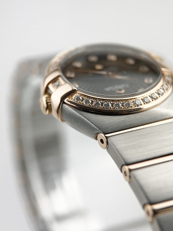 57_c59852e5-770f-4bf8-8dd5-06d150db818e Omega Constellation Rose Gold & Steel Brown Dial 24mm Quartz 123.25.24.60.63.001